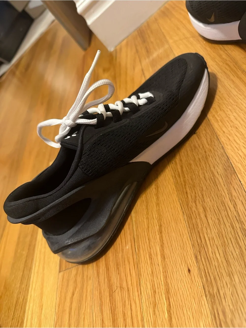 Nike women’s Black and White Sneakers